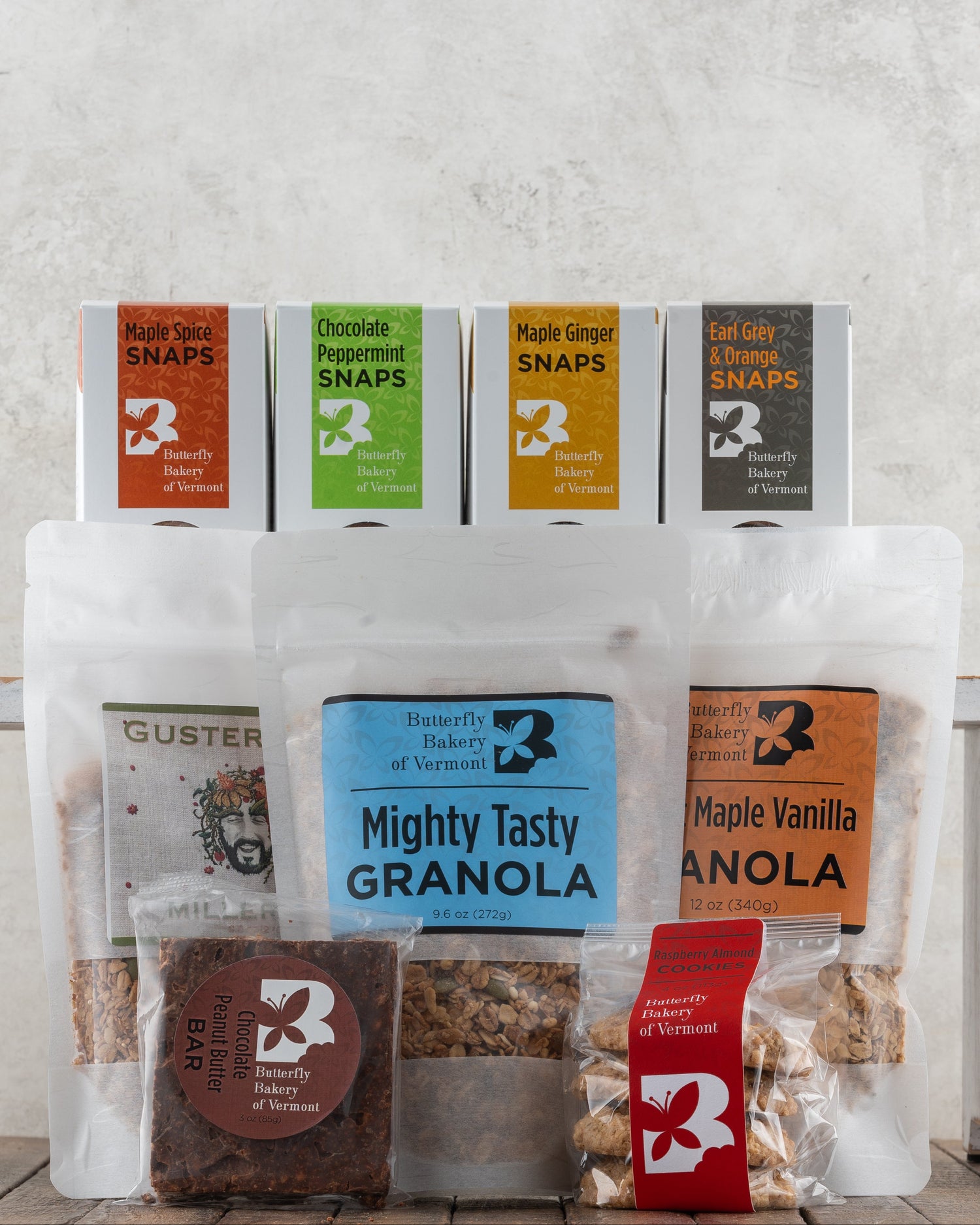 Butterfly Bakery of Vermont full line of maple sweetened baked goods on a wood surface