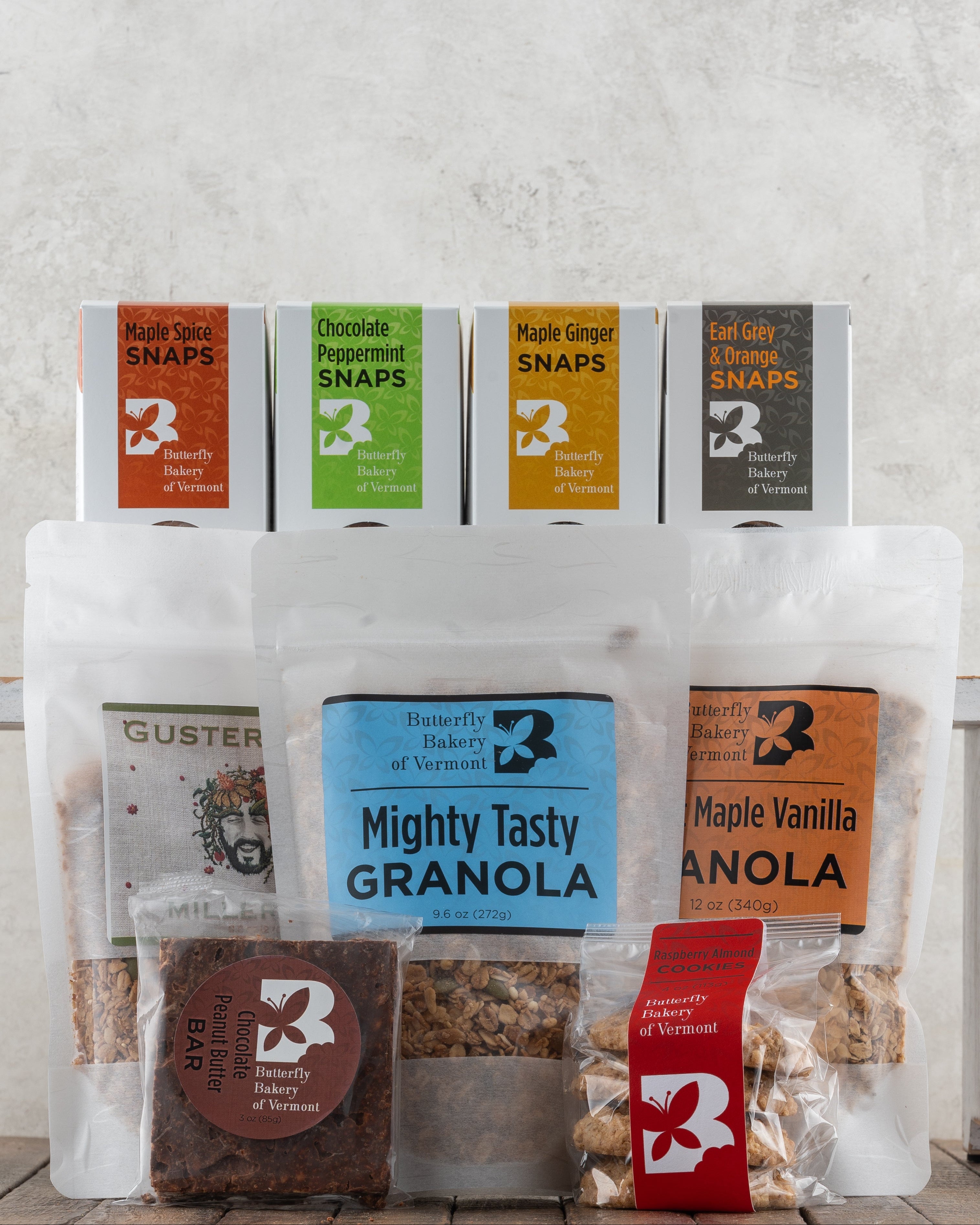 Butterfly Bakery of Vermont full line of maple sweetened baked goods on a wood surface