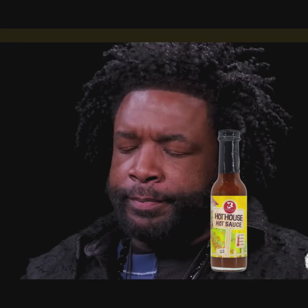 Video clip from Hot Ones with Questlove reacting to eating Hot House hot sauce from Butterfly Bakery of Vermont